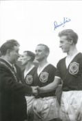 Denis Law signed 12x8 black and white photo. Denis Law CBE (born 24 February 1940) is a Scottish