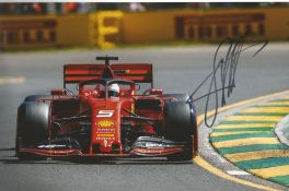 Sebastian Vettel signed Ferrari Formula One 12x8 colour photo.Good condition. All autographs come