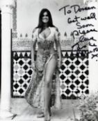 Caroline Munro English Actress, Model And Singer 10x8 Signed B/W Photo Dedicated. Good condition.