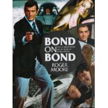 James Bond Actor, Roger Moore signed hardback book titled Bond On Bond, The Ultimate book on 50