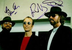 The Bee Gees 8x12 Photo Signed By Barry Gibb, Robin Gibb (1949-2012) and Maurice Gibb (1949-2003)