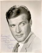 Roger Moore signed 10x8 vintage black and white photo inscribed thank you for the leukaemia