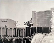 Evel Knievel signed 20x16 black and white photo pictured in action at Caesars Palace Las Vegas in