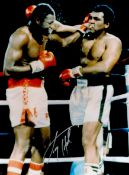 Larry Holmes signed 16x12 colour photo pictured during his World Heavyweight title match with