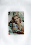 Julie Ege Signed 6x4 Colour Photo. Attached to A4 Sheet. Ege was a Norwegian actress and model,