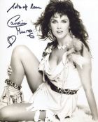 007 Bond girl Caroline Munro signed sexy 8x10 photo. Good condition. All autographs come with a