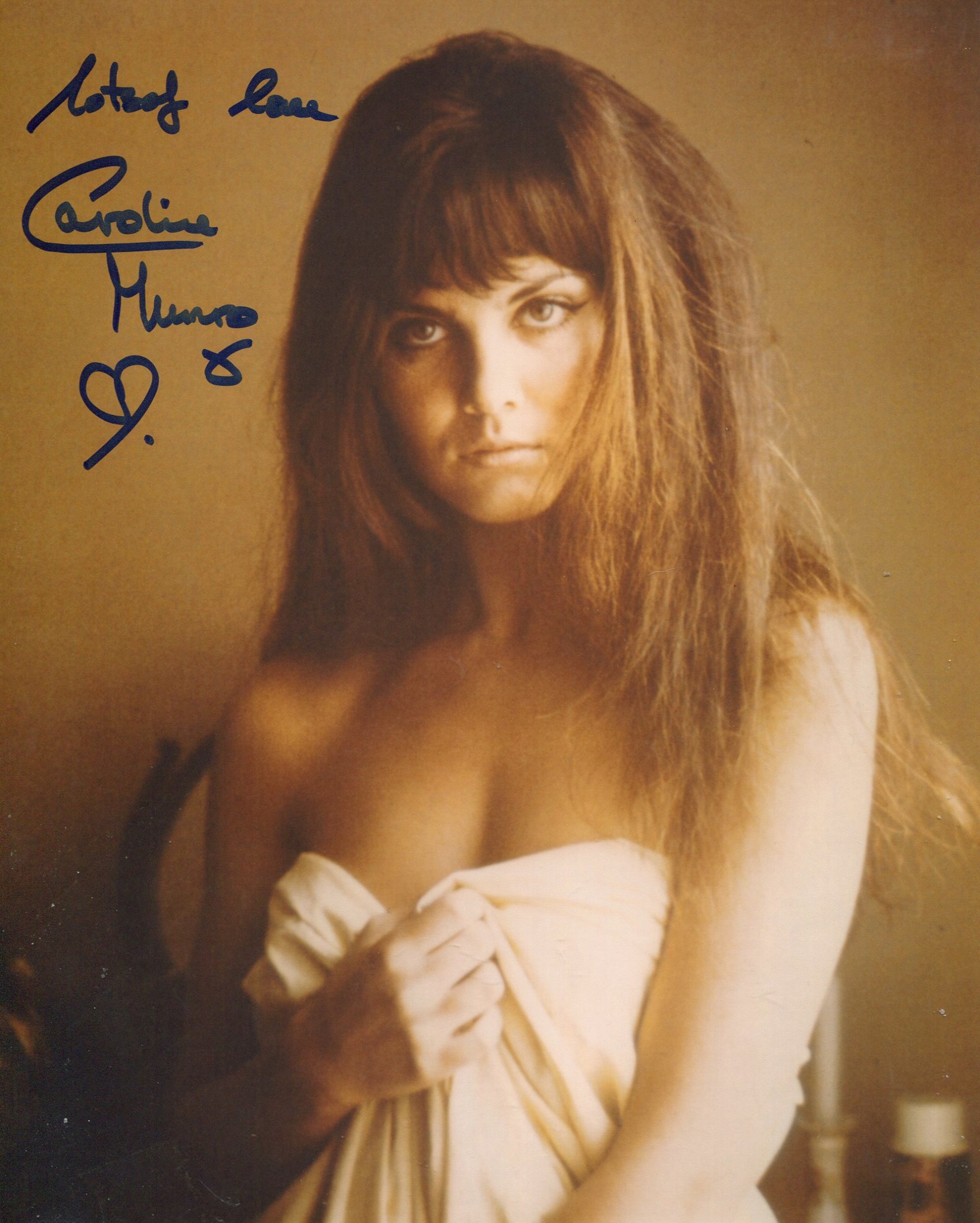 007 Bond girl Caroline Munro signed sexy 8x10 photo. Good condition. All autographs come with a