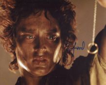 Lord of the Rings 8x10 photo signed by actor Elijah Wood as Frodo Baggins. Good condition. All