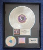 Singer, Elton John commemorative Platinum Sales Award framed and professionally presented. This item