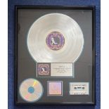 Singer, Elton John commemorative Platinum Sales Award framed and professionally presented. This item