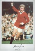 Football Denis Law signed 20x13 colour print pictured during his playing days with Manchester
