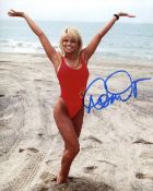 Baywatch stunner Donna D Errico signed sexy red Baywatch swimsuit photo. Good condition. All