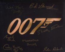 007 James Bond promo photo signed by SEVEN assorted Bond girls and actors including Shirley Eaton,