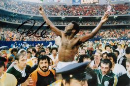 Pele signed 12x8 colour photo pictured during his time with the New York Cosmos. Good condition. All