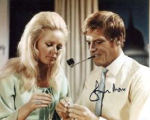 Roger Moore signed 8x10 photo scene from the TV series The Saint. Good condition. All autographs