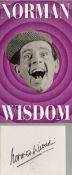 Norman Wisdom signed cardboard cutout. Includes unsigned photo. Wisdom, OBE (4 February 1915 – 4