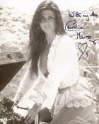 007 Bond girl Caroline Munro signed sexy 8x10 photo. Good condition. All autographs come with a