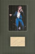 Singer, Tom Jones matted 15x10 signature piece featuring a colour photograph of Jones performing