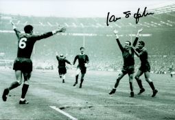 Ian St John signed Liverpool F.C 12x8 black and white photo. John Ian St John ( 7 June 1938 - 1