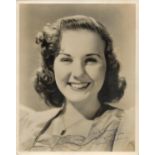 Deanna Durbin signed 10 x 8 black and white photo. Durbin was an actress and singer. She appeared in