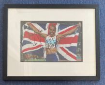 Dame Kelly Holmes Hand signed 12x8 Colour Photo of Holmes after winning two Gold Medals in Athens in