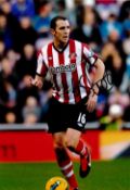 Football John O'Shea signed Sunderland 12x8 colour photo. John Francis O'Shea (born 30 April 1981)