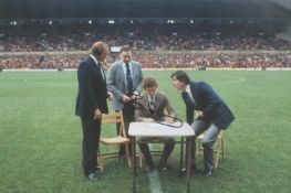 Football Bryan Robson signed 12x8 colour photo pictured signing for Manchester United. Bryan