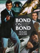 James Bond Actor, Roger Moore signed hardback book titled Bond On Bond, The Ultimate book on 50