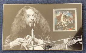 Jethro Tull. Ian Anderson signed mounted presentation photograph featuring a signed cover by