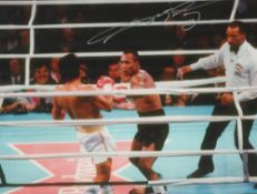 Boxing Sugar Ray Leonard signed 16x12 inch colour photo pictured during one of his fights with