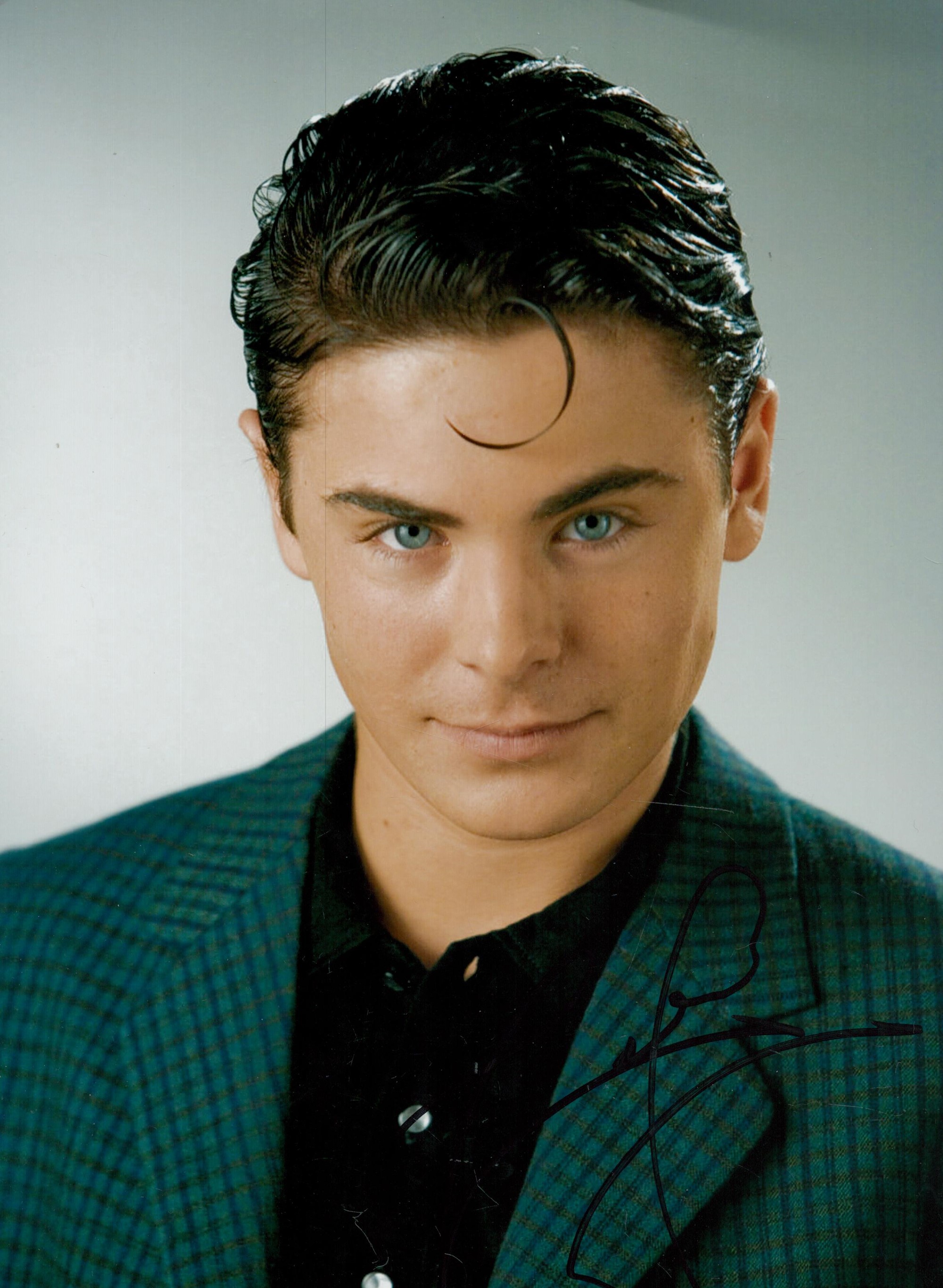 Actor, Zac Efron signed 12x8 inch colour photograph. Efron is well known for roles in High School
