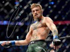 CONOR McGREGOR UFC FIGHTER. Lovely authentic signed photo of Irish UFC fighter. Photo measures 16