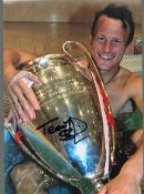 Football Teddy Sheringham signed 12x8 colour photo pictured holding the Champions League Trophy.