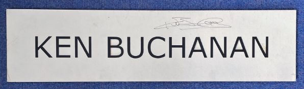 British Boxer Ken Buchanan Signed Personal Named Black and White Mount. Measures 24x6 Overall.