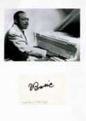 Music Count Basie signature piece below black and white photo. Good condition. All autographs come