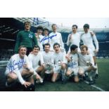 Autographed LEEDS UNITED 12 x 8 photo - Col, depicting players celebrating with the League Cup in