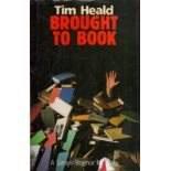 Tim Heald Brought To Book Fine with complete Dust Jacket, Wrapper Hardback 1st Edition 1988 Book. We