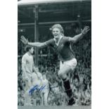 Football Autograph GORDON McQUEEN 12 x 8 photo B W, depicting the Man United centre-half running