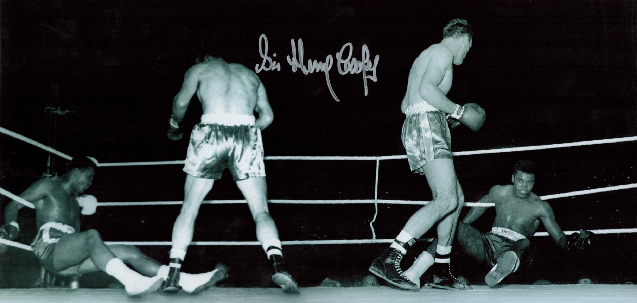 Sir Henry Cooper Signed 18 x 8 Black and White Photo. Photo shows Cooper in action. Good