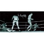 Sir Henry Cooper Signed 18 x 8 Black and White Photo. Photo shows Cooper in action. Good