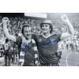 Football Autograph NOTTM FOREST 12 x 8 photo B W, depicting FRANK CLARK and LARRY LLOYD arm in arm