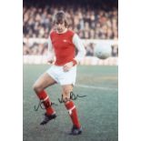 Football Autograph Alan HUDSON 12 x 8 photo Col, depicting the Arsenal midfielder warming up in