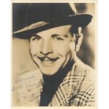 Dick Powell signed 10x8 sepia vintage photo dedicated with original Warner Bros mailing envelope