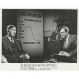 Peter Cook, a signed 10x8 Whoops Apocalypse (1986) film photo, with Cook playing Sir Mortimer Chris.