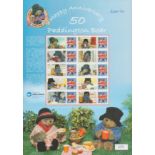 Michael Bond signed Happy 50th anniv Paddington Bear stamp sheet. £10 of mint stamps. Good