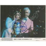 Monty Python's The Meaning of Life, a 10x8 film photo. Signed by Monty Python stars Eric Idle and