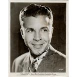 Dick Powell signed 10x8 black and white photo. Few knocks and creases to photo. (November 14, 1904 -