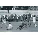 Autographed ALAN KENNEDY 12 x 8 photo - B/W, depicting the Liverpool left-back scoring the opening