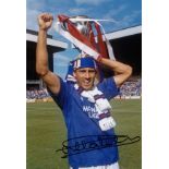 Autographed MARK HATELEY 12 x 8 photo - Col, depicting the Rangers centre-forward holding aloft