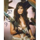 At the Earth's Core 8x10 movie photo signed by actress Caroline Munro. Good condition. All